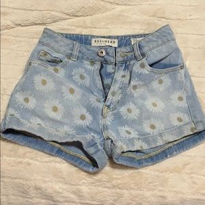High-waisted blue jean shorts.